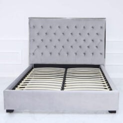 Grey King Size Bed With A Chrome Frame And Velvet Style Upholstery