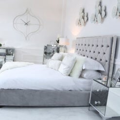 Grey Double Size Bed With A Chrome Frame And Velvet Style Upholstery