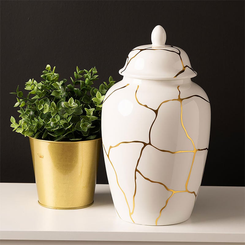 https://pictureperfecthome.co.uk/wp-content/uploads/2023/11/White-And-Gold-Ceramic-Ginger-Jar-With-Lid-31cm-3.jpg
