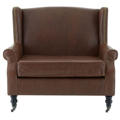 Industrial Brown Faux Leather Winged Studded Armchair With Carved Black Wood Legs And Wheels