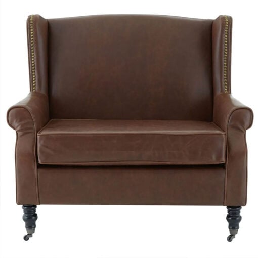 Industrial Brown Faux Leather Winged Studded Armchair With Carved Black Wood Legs And Wheels