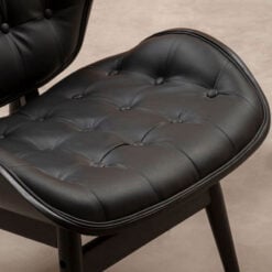 Mid Century Black Faux Leather And Black Wood Tufted Winged Accent Chair With A Curved Seat Mid Century Black Faux Leather And Black Wood Tufted Winged Accent Chair With A Curved Seat