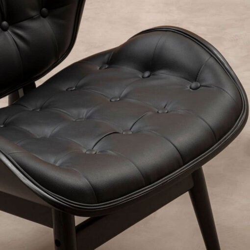 Mid Century Black Faux Leather And Black Wood Tufted Winged Accent Chair With A Curved Seat Mid Century Black Faux Leather And Black Wood Tufted Winged Accent Chair With A Curved Seat