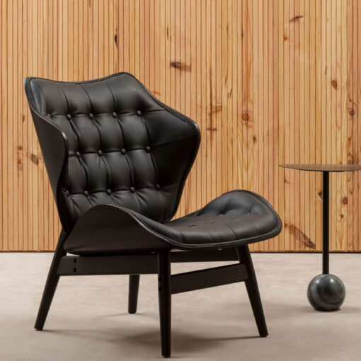 Mid Century Black Faux Leather And Black Wood Tufted Winged Accent Chair With A Curved Seat Mid Century Black Faux Leather And Black Wood Tufted Winged Accent Chair With A Curved Seat