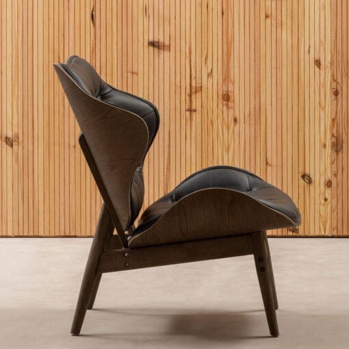 Mid Century Black Faux Leather And Black Wood Tufted Winged Accent Chair With A Curved Seat Mid Century Black Faux Leather And Black Wood Tufted Winged Accent Chair With A Curved Seat
