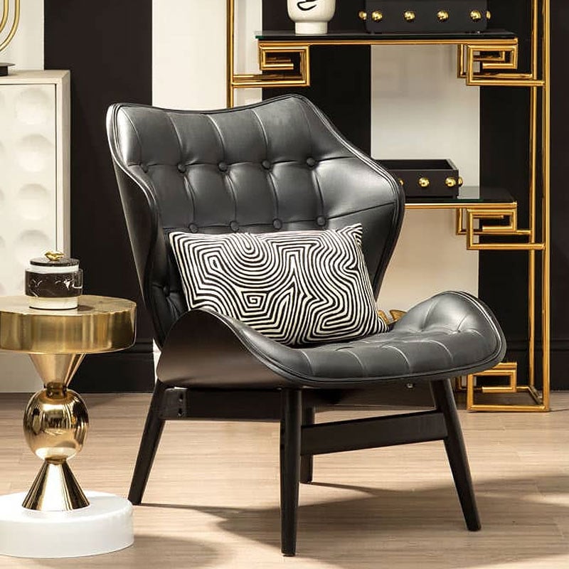 Mid Century Black Faux Leather And Black Wood Tufted Winged Accent Chair With A Curved Seat Mid Century Black Faux Leather And Black Wood Tufted Winged Accent Chair With A Curved Seat