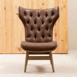 Mid Century Brown Faux Leather And Light Wood Tufted Winged High Back Accent Chair With A Curved Seat